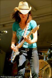 llory mcdonald performing on an outdoor stage